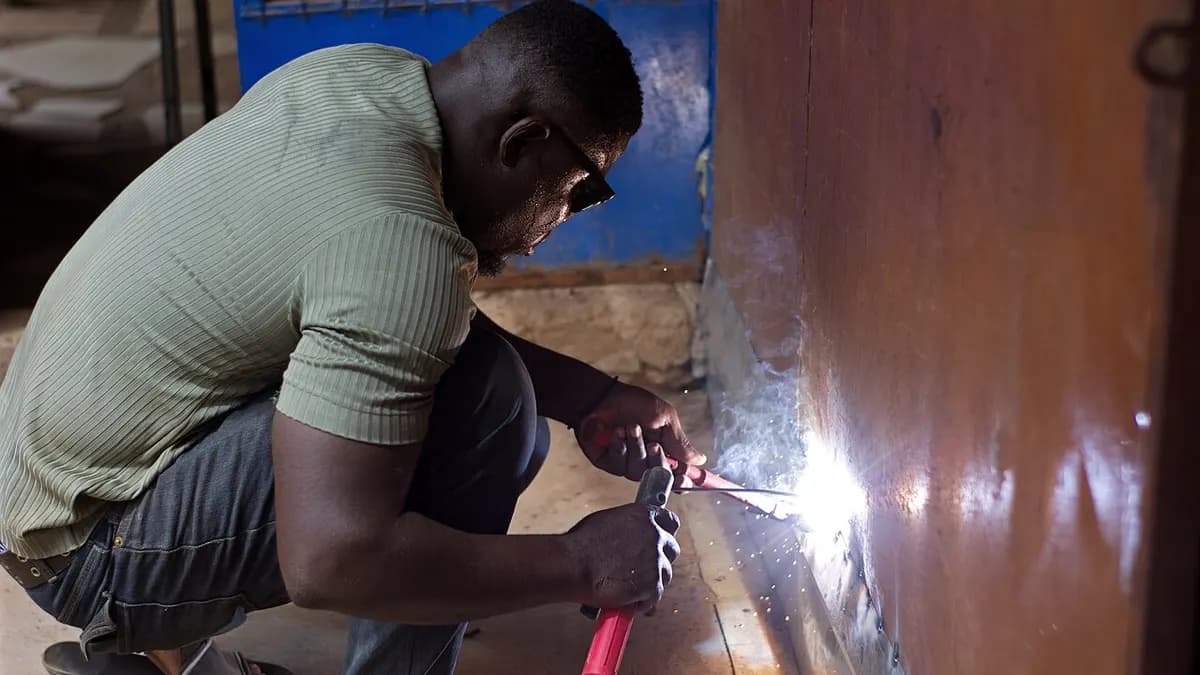 A welder performing hands-on work in a professional shop